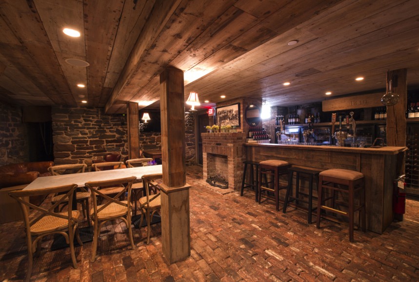 Speakeasy with old brick floors, fieldstone walls